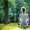 Woman meditating and practicing yoga in forrest